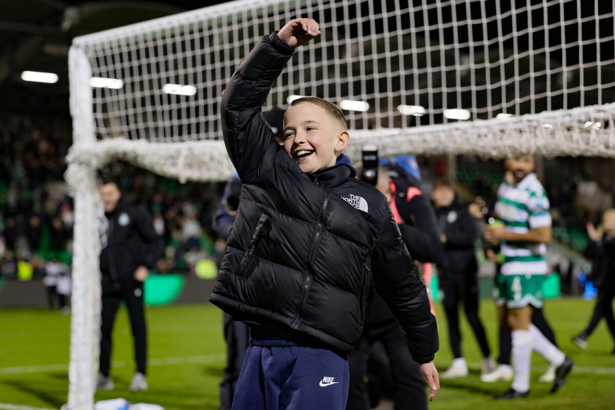 Shamrock Rovers manager Stephen Bradley’s son Josh celebrates with fans after the match. Pic: ©INPHO/Laszlo Geczo.