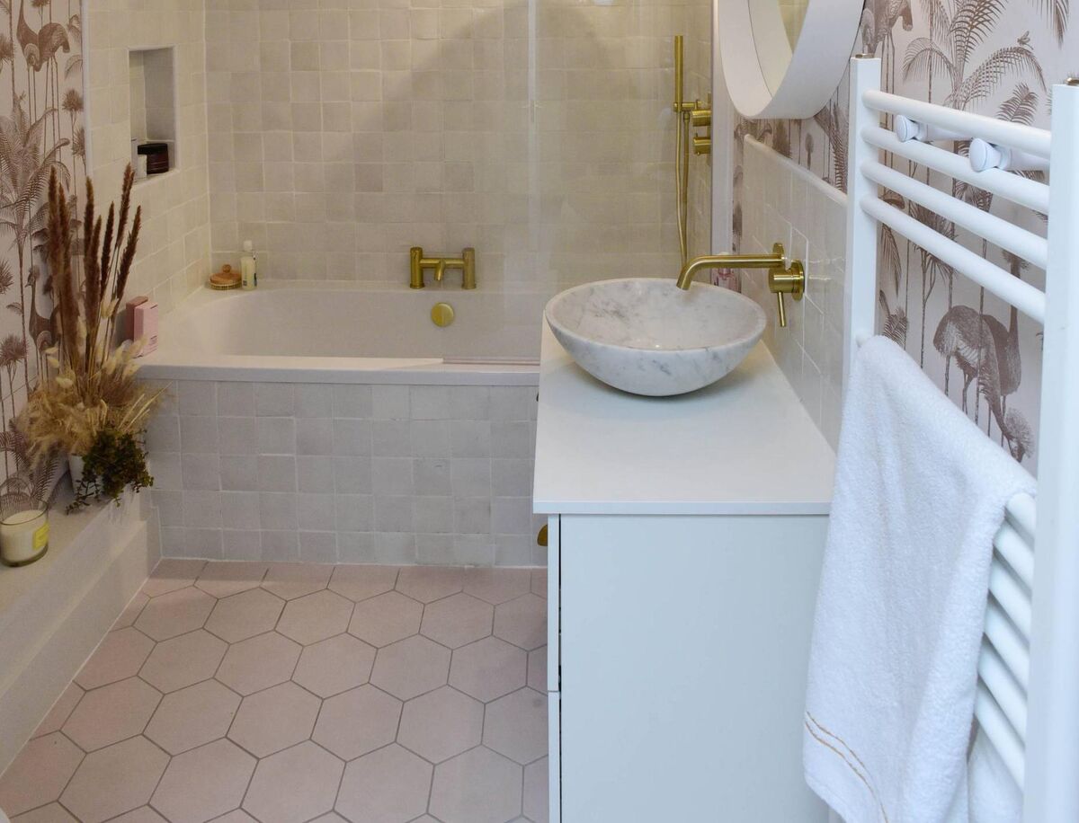 Tiling in Jennifer Sheahan's bathroom: Ensure builders, electricians, gas installers, and plumbers are registered, she advises. 