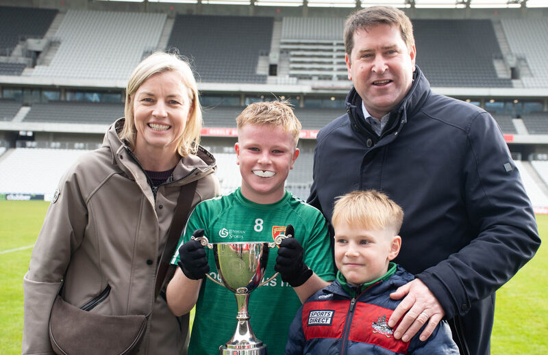Killeagh joint captain Charlie Landers pictured with his parents Jackie and Mark and brother James with the Allianz Sciath na Scol DF4 trophy in Parc Ui Chaoimh.. Picture: Howard Crowdy Killeagh joint captain Charlie Landers pictured with his parents Jackie and Mark and brother James with the Allianz Sciath na Scol DF4 trophy in Parc Ui Chaoimh.. Picture: Howard Crowdy