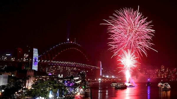 The 9pm family fireworks explode over the Sydney Opera House and Sydney Harbour Bridge on Sydney Harbour during New Year's Eve celebrations in Sydney, Tuesday, Dec. 31, 2019. (Dean Lewins/AAP Image via AP)