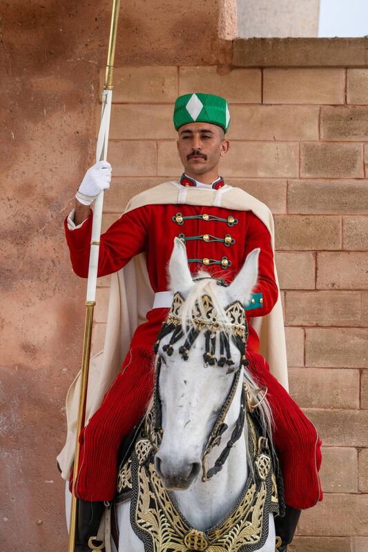 Royal guard in front of Hassan Tower and Mausoleum of Mohammed V. Mausoleum which contains tombs of late King Hassan II and Prince Abdallah.