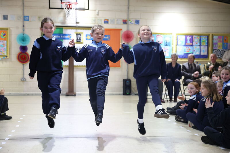President Catherine Connolly watches pupils perform Irish dancing during a visit to Gaelscoil Inse Chor in Kilmainham, Dublin. Picture: Damien Eagers/PA Wire