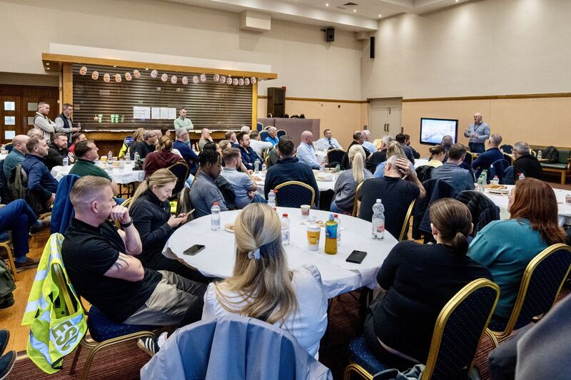 Garda personnel watch an instructional video as part of the pre-operation briefing at the Sportslink in Santry ahead of Operation Trench. The session provided guidance on safety, restraint, and escort procedures to ensure a secure and orderly deportation process. Picture: Chani Anderson