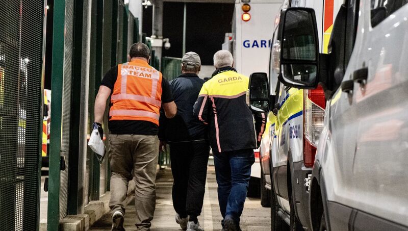 Deportees are escorted through security checks at Dublin Airport during Operation Trench, with garda teams overseeing each step to ensure safety, order, and humane treatment. Picture: Chani Anderson