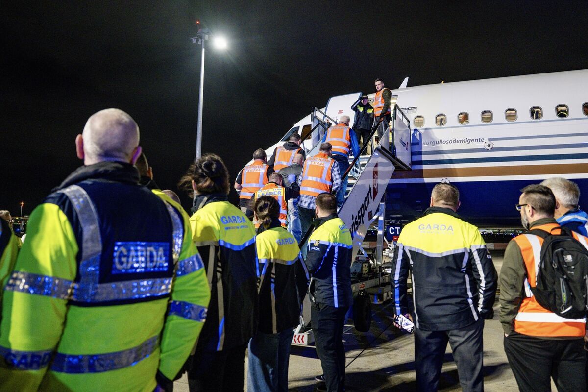 Most of the individuals appeared calm as they boarded, while garda teams ensured the process was safe and orderly. Picture: Chani Anderson