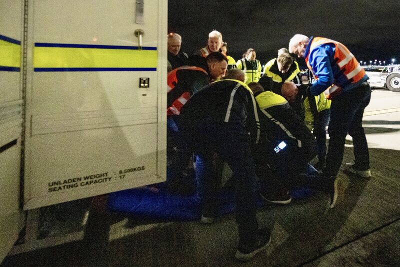 Gardaí restrain an individual who became non-compliant during boarding. The procedure, using only approved restraints such as Velcro and cable ties, was outlined in the pre-operation safeguarding briefing given to all members of the escort teams. Picture: Chani Anderson
