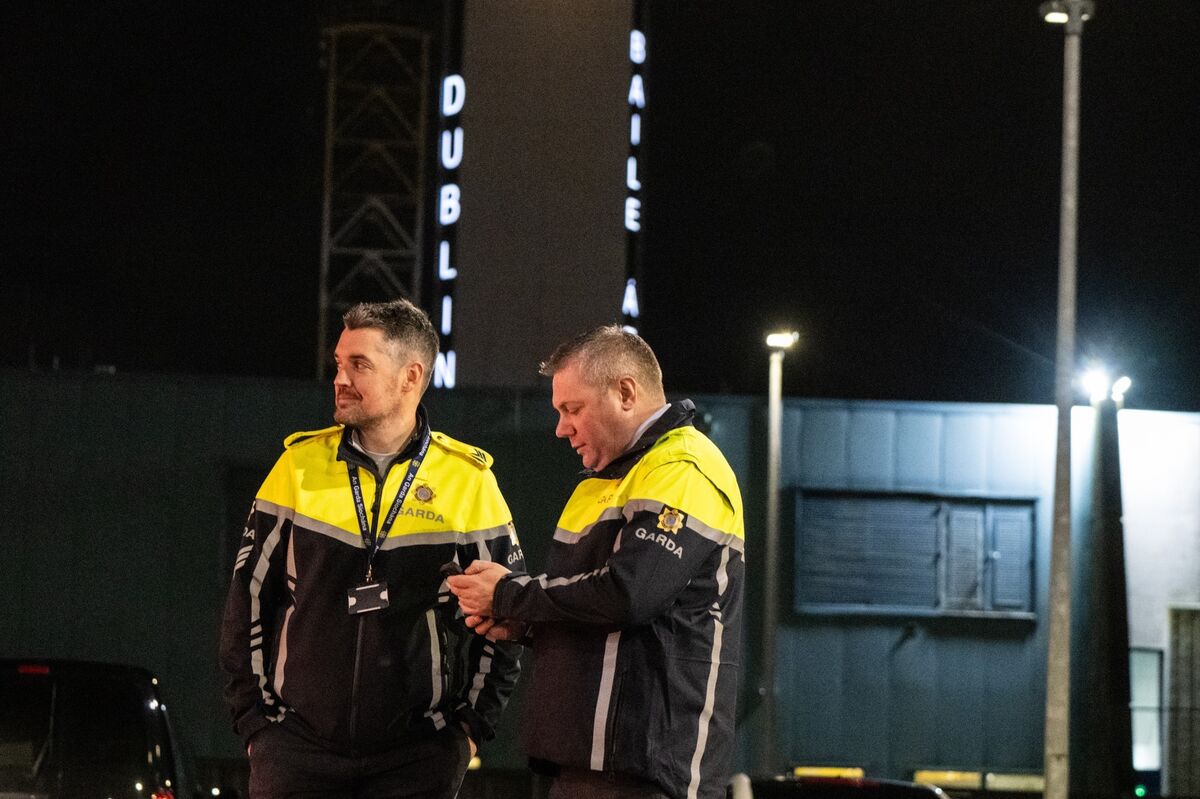 Detective Superintendent Dave Kennedy, the head of operations for Operation Trench, monitors airside activity at Dublin Airport as deportees are escorted through security checks and prepared for boarding. Picture: Chani Anderson