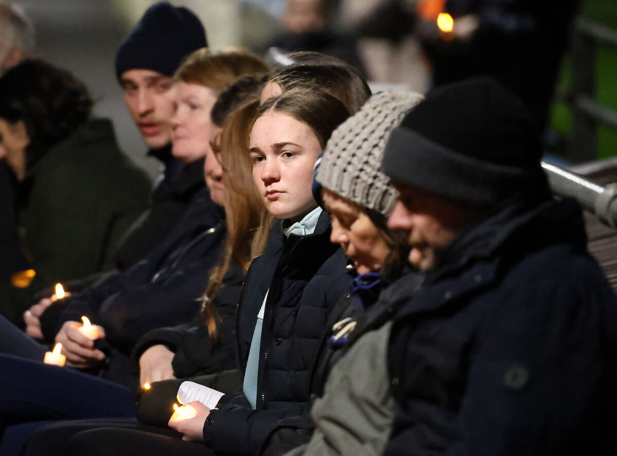  Ava Sheridan, a cousin of Chloe McGee, and other close friends and relatives at Aughnamullen Sarsfields GAA Club in Co Monaghan for Tuesday night's candlelit vigil for 23-year-old Chloe and the four other young people who died in the collision on the Ardee Road, near Dundalk on Saturday night. Picture: Colin Keegan/Collins