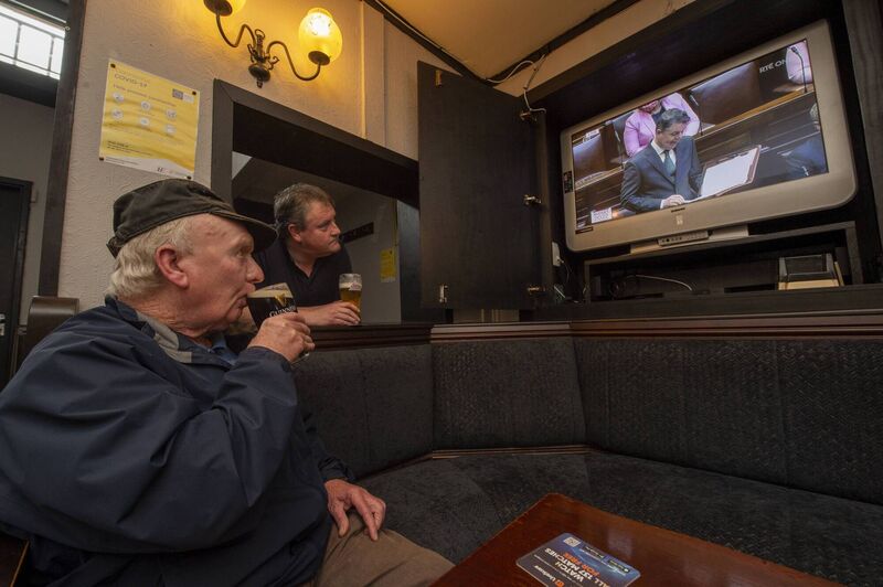 Timmy Murphy and Conor McCarthy enjoying a pint at the Southside Bar, Bandon Rd, Cork as they watch then finance minister Pascal Donoghue delivering Budget 2022. Picture: Dan Linehan