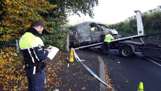 <p>A burnt-out Garda van is taken away after rioters set it on fire during a protest outside the Citywest Ipas centre in Saggart, Dublin, in October. Picture: Padraig O'Reilly</p>