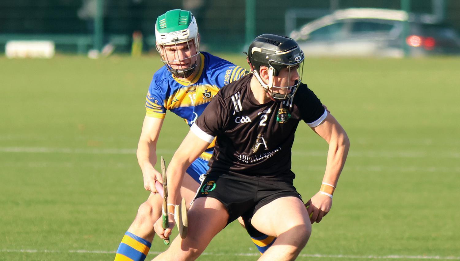 Diarmuid Fogarty, St Joseph's CBS Nenagh in possession against Tudor Meracre, Cashel Community School in the Harty Cup
