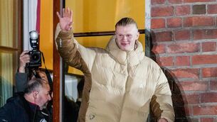 <p>Erling Haaland greets the people from the city hall balcony after the victory in the World Cup qualifying match between Norway and Italy. Pic: Heiko Junge/NTB via AP.</p>