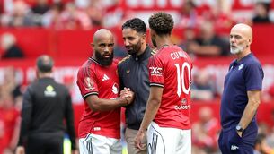 <p>Bryan Mbeumo and Matheus Cunha interact with Ruben Amorim. Pic: Matt McNulty/Getty Images.</p>