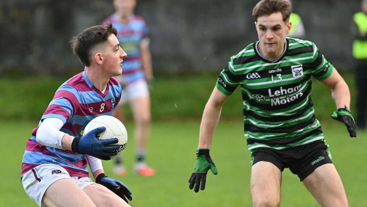 Douglas' Eoin O'Flynn closes in on Dermot Dineen on bane Gaels. Pic: Dan Linehan