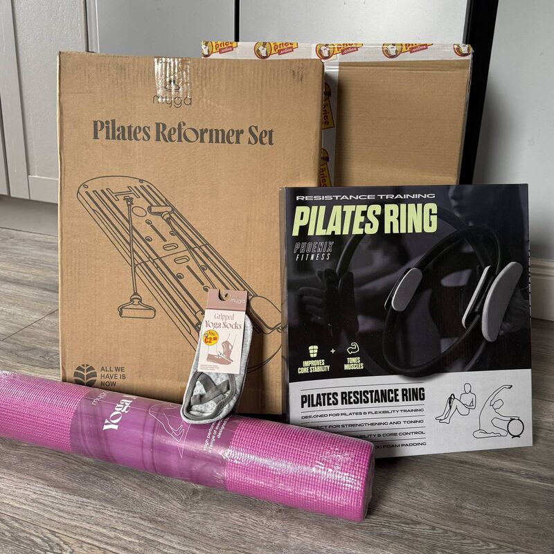The reformer set in its box, along with other fitness items from the Mr Price range