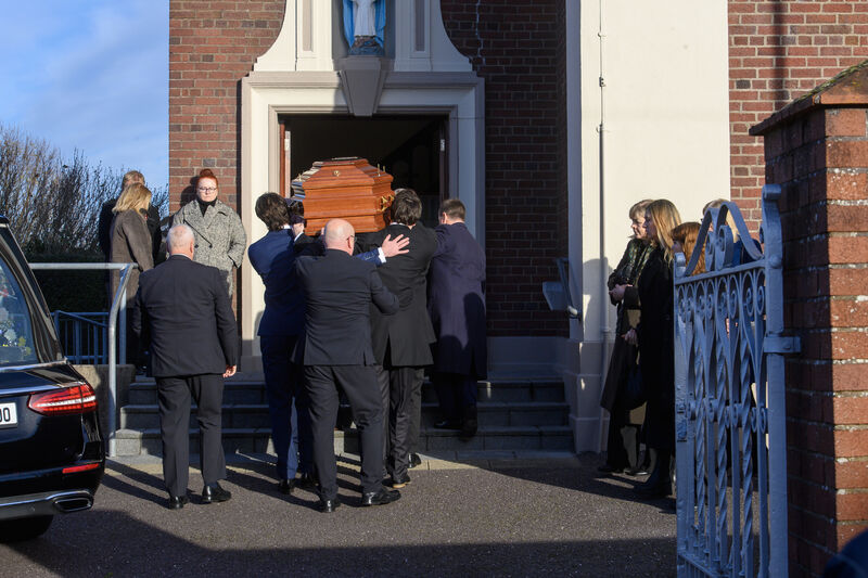  Family members carry Stella Gallagher on her final journey to the Church of Our Lady of Lourdes, Ballinlough, Cork. Picture:  Dan Linehan