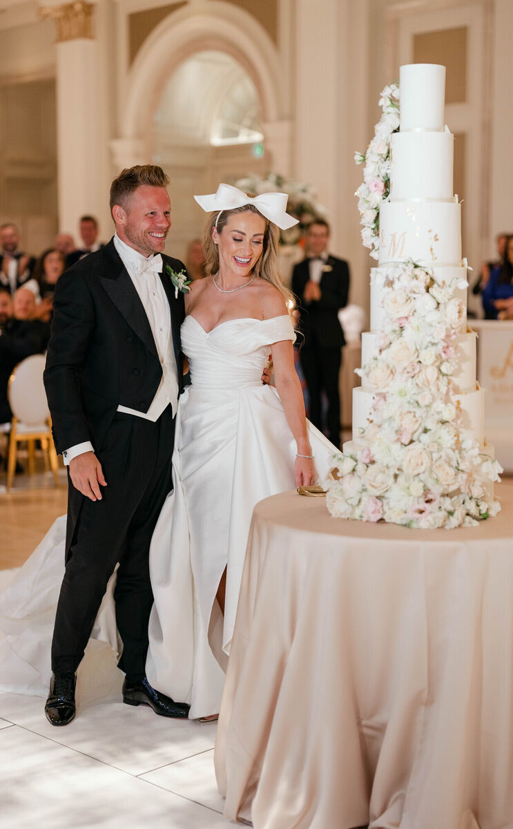 Maeve Madden and Andrew with their wedding cake