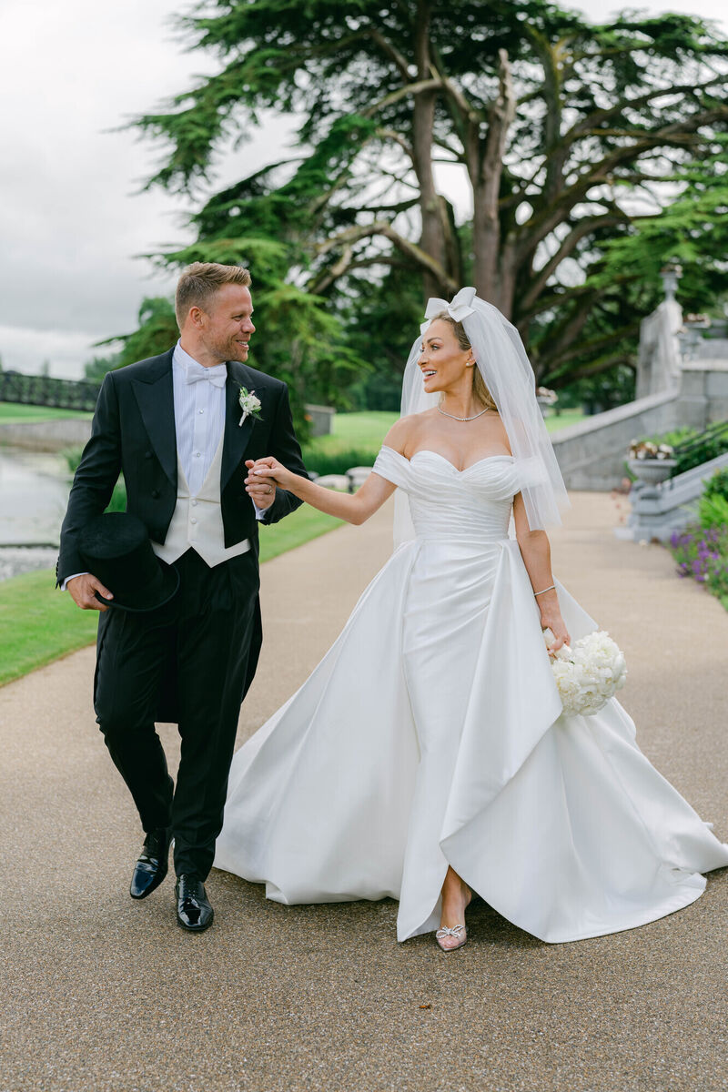 Maeve Madden: "Our theme for the wedding was opulent elegance. I wanted something that looked timeless and classic. Our bridesmaids' dress were black, and Andrew and the groomsmen wore top hats and tails. We also went black tie for the guests."