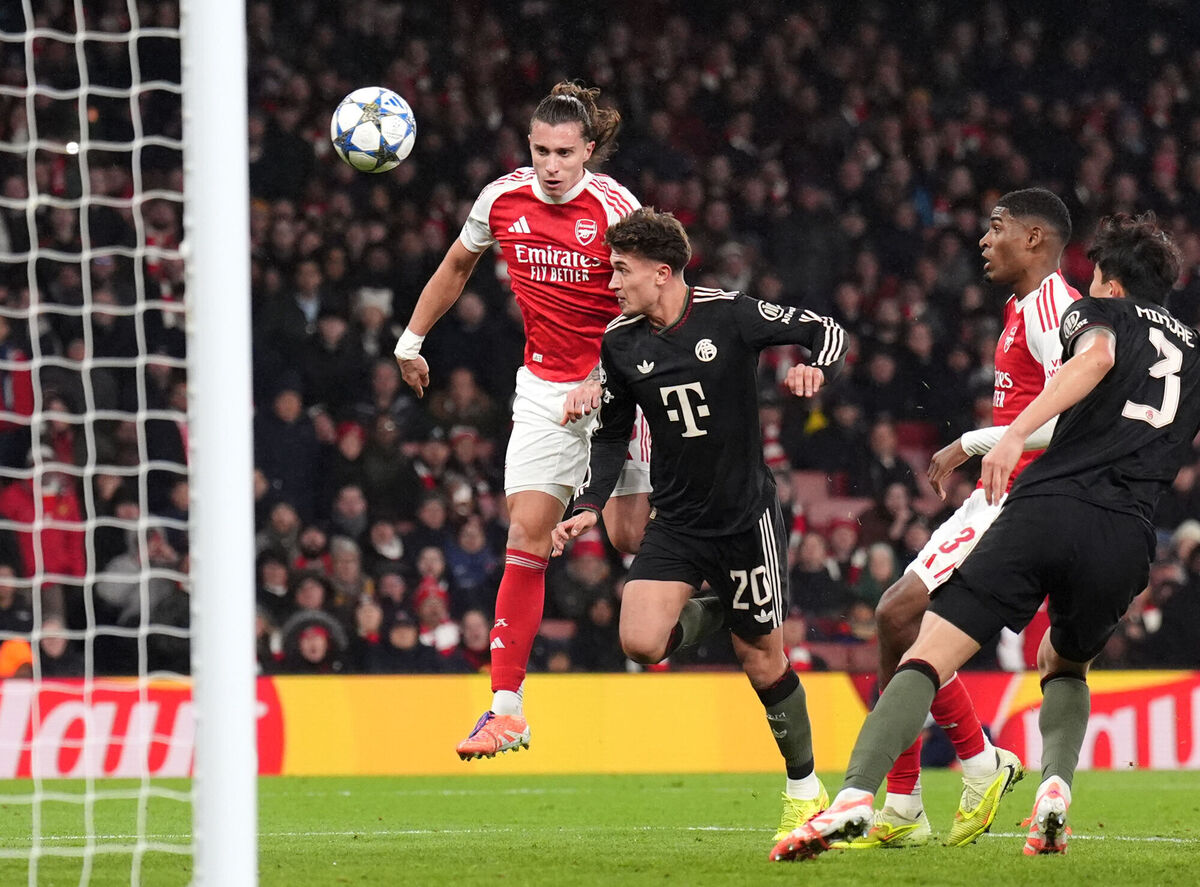 Arsenal's Riccardo Calafiori heads at goal under pressure from Bayern Munich's Tom Bischof. Pic: John Walton/PA
