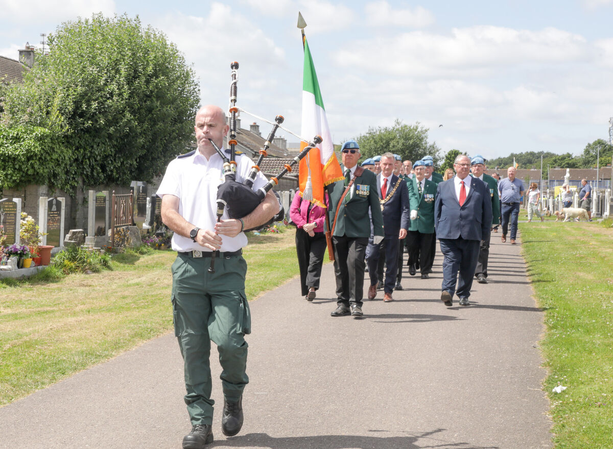 Piper Pat McCarthy of the National Ambulance Service leads the procession for the memorial ceremony at St Michael's cemetery, Blackrock, Cork for those who died in Air India Flight 182 disaster when it came down off the Cork Coast in 1985.- Picture: David Creedon