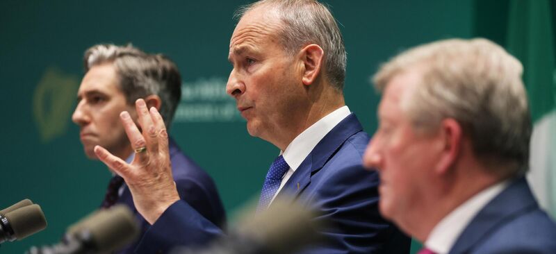 Tánaiste Simon Harris, Taoiseach Micheál Martin, and minister of state Seán Canney announcing details of the revised National Development Plan in July. File picture
