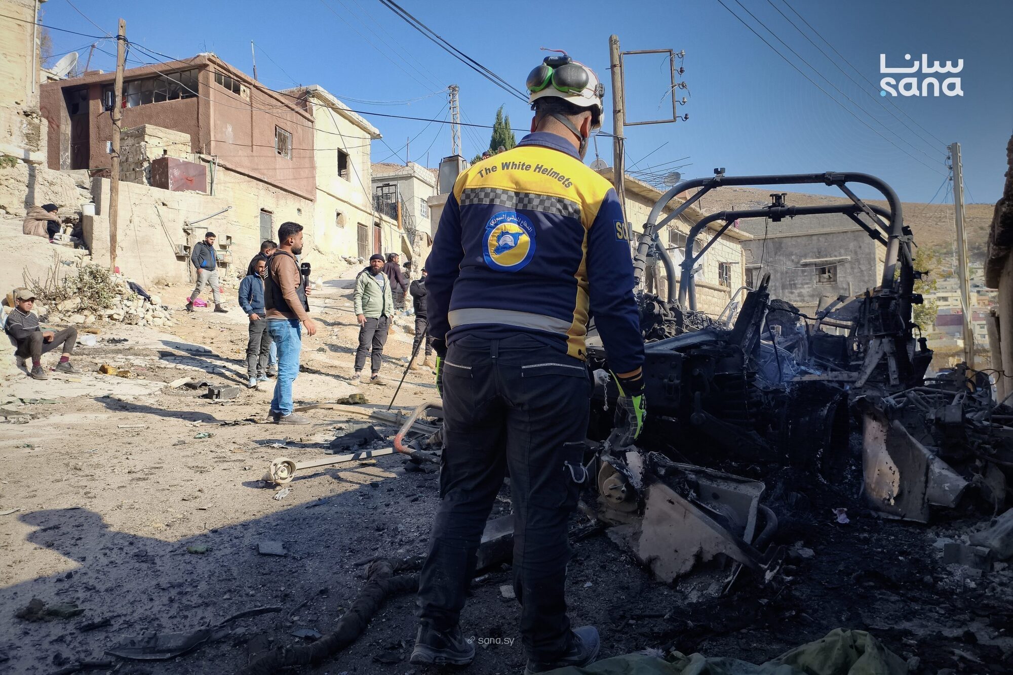 Israeli forces kill at least 13 people in southern Syria raid, officials and residents say