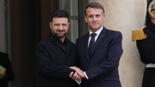 French President Emmanuel Macron, right, welcomes Ukrainian President Volodymyr Zelenskyy (Christophe Ena/AP)