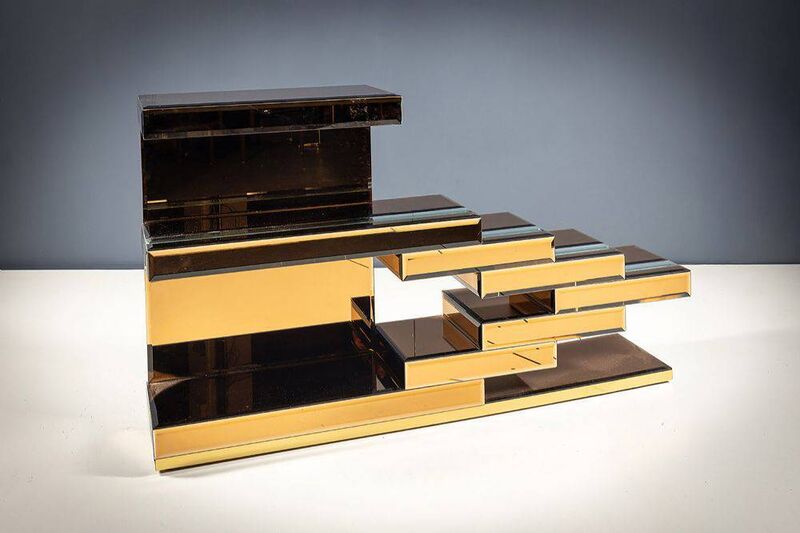 An Italian tinted mirror and tiered hall table at deVeres.