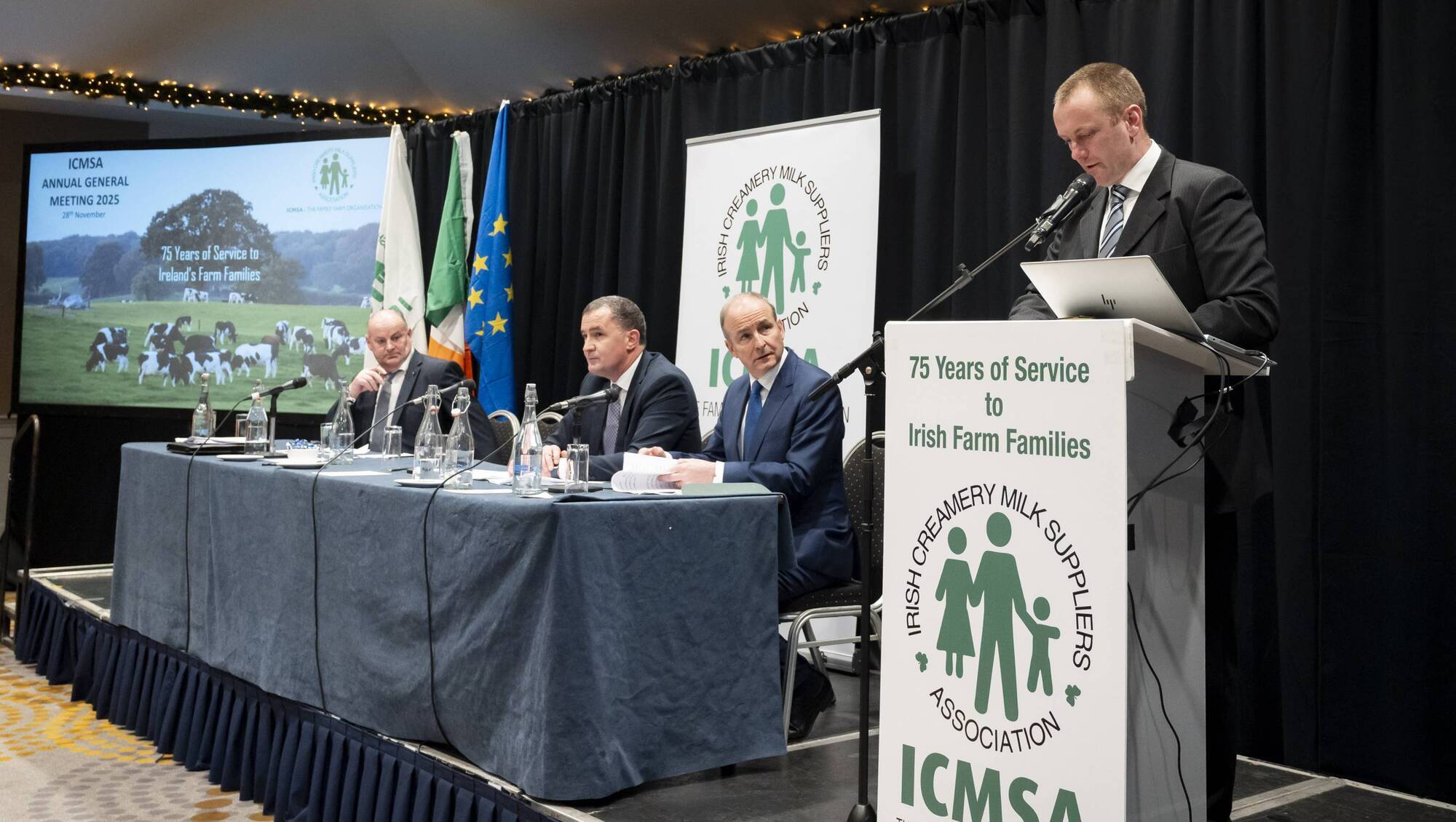 ICMSA president Denis Drennan addresses the AGM as Taoiseach Micheál Martin looks on. Also pictured are ICMSA general secretary John Enright, and deputy president Eamon Carroll Picture: Don Moloney