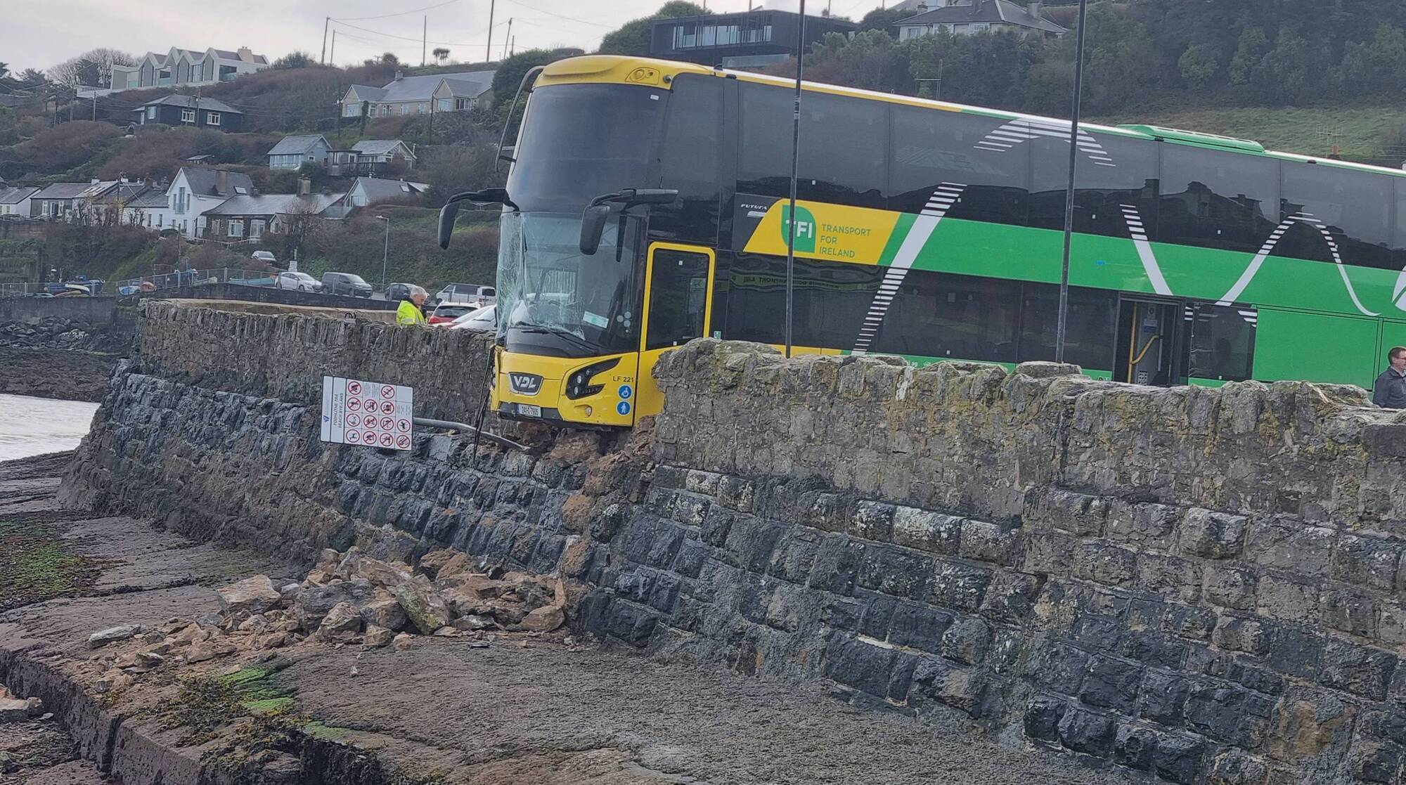 Double decker bus crashes through sea wall after driver parks it at Waterford tourist spot