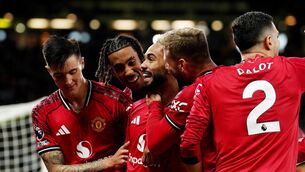 <p>Manchester United's Matheus Cunha celebrates with team-mates.</p>