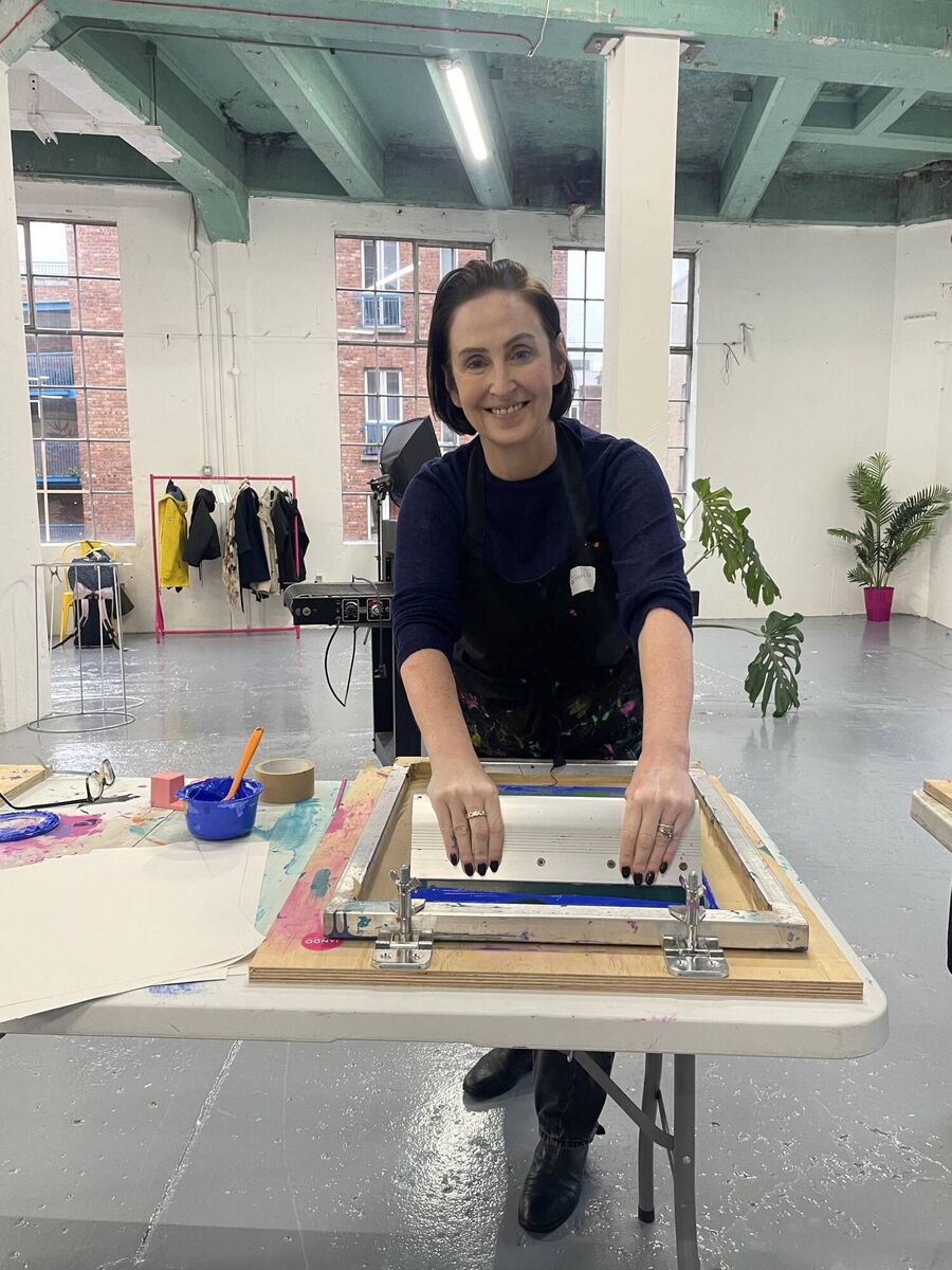 Gemma screen printing in Jando's workshop in Dublin Gemma screen printing in Jando's workshop in Dublin