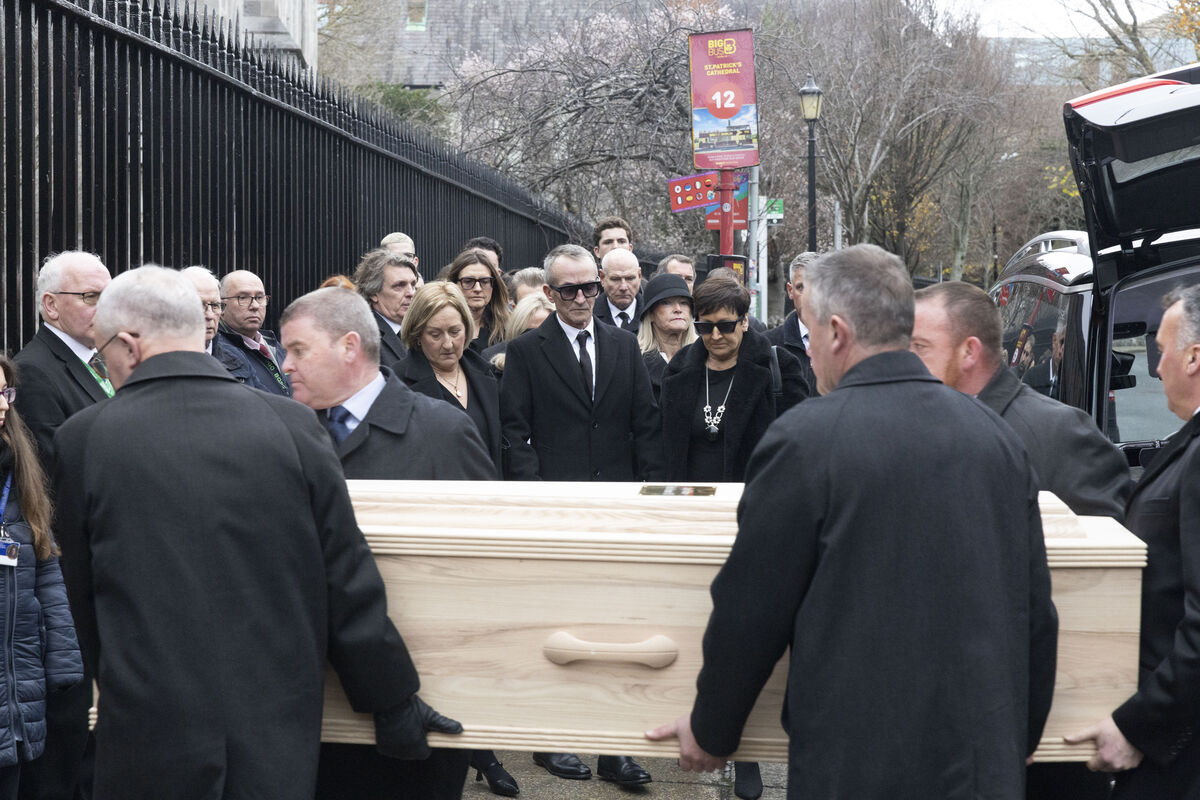 The Funeral Cortege arrives as Hugh Wallace's husband Martin Corbett and family members watch on. Picture: SAM BOAL/Collins Photos 