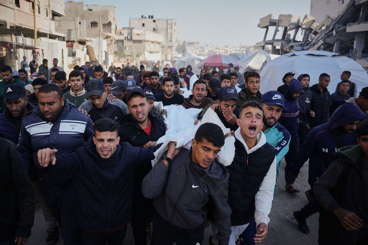 Thursday, December 4: Mourners in Khan Younis, Gaza, carrying the bodies of Palestinians killed in an Israeli military strike.  Picture: Abdel Kareem Hana/AP