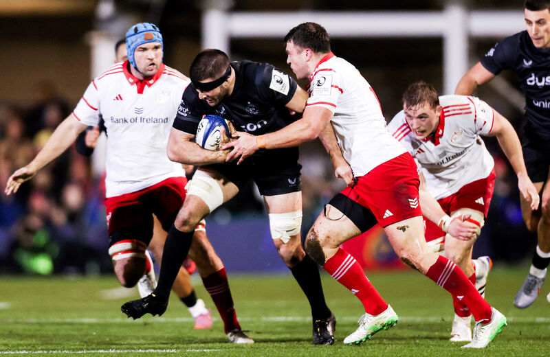 Bath's Josh Bayliss is challenged by Tadhg Beirne, Shane Daly and Gavin Coombes of Munster Bath's Josh Bayliss is challenged by Tadhg Beirne, Shane Daly and Gavin Coombes of Munster