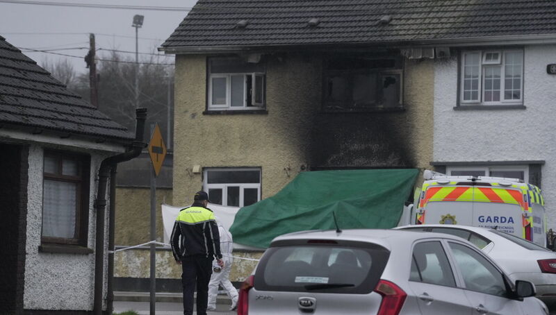 Gardaí at the scene of a house fire in Edenderry, Co Offaly, where a woman and a young boy have died. Picture: Aisling Hyland/PA Wire Gardaí at the scene of a house fire in Edenderry, Co Offaly, where a woman and a young boy have died. Picture: Aisling Hyland/PA Wire