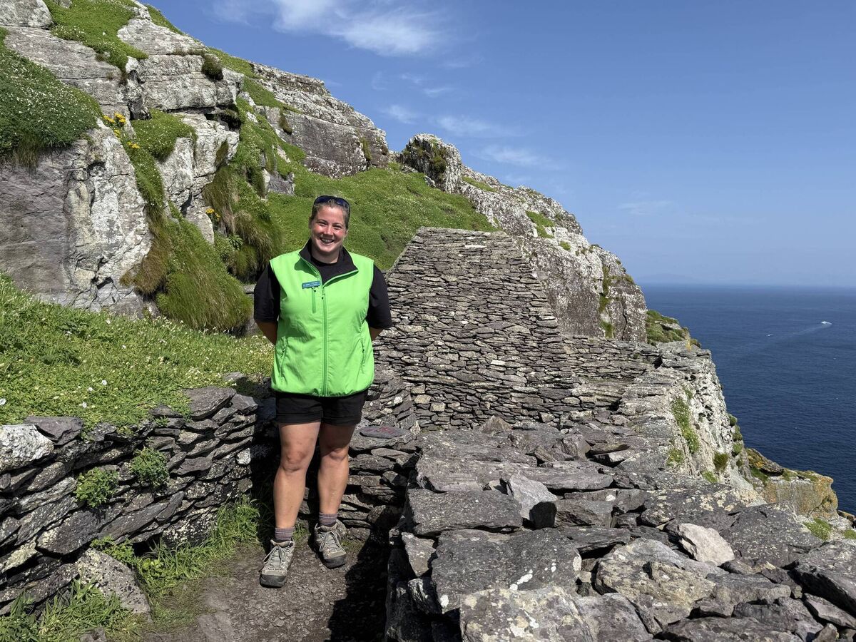 Skellig pictures. OPW Guide Cornelia Lyne in front of the oratory restored by her father Cornelius Lyne Skellig Michael. Picture: Gemma Tipton