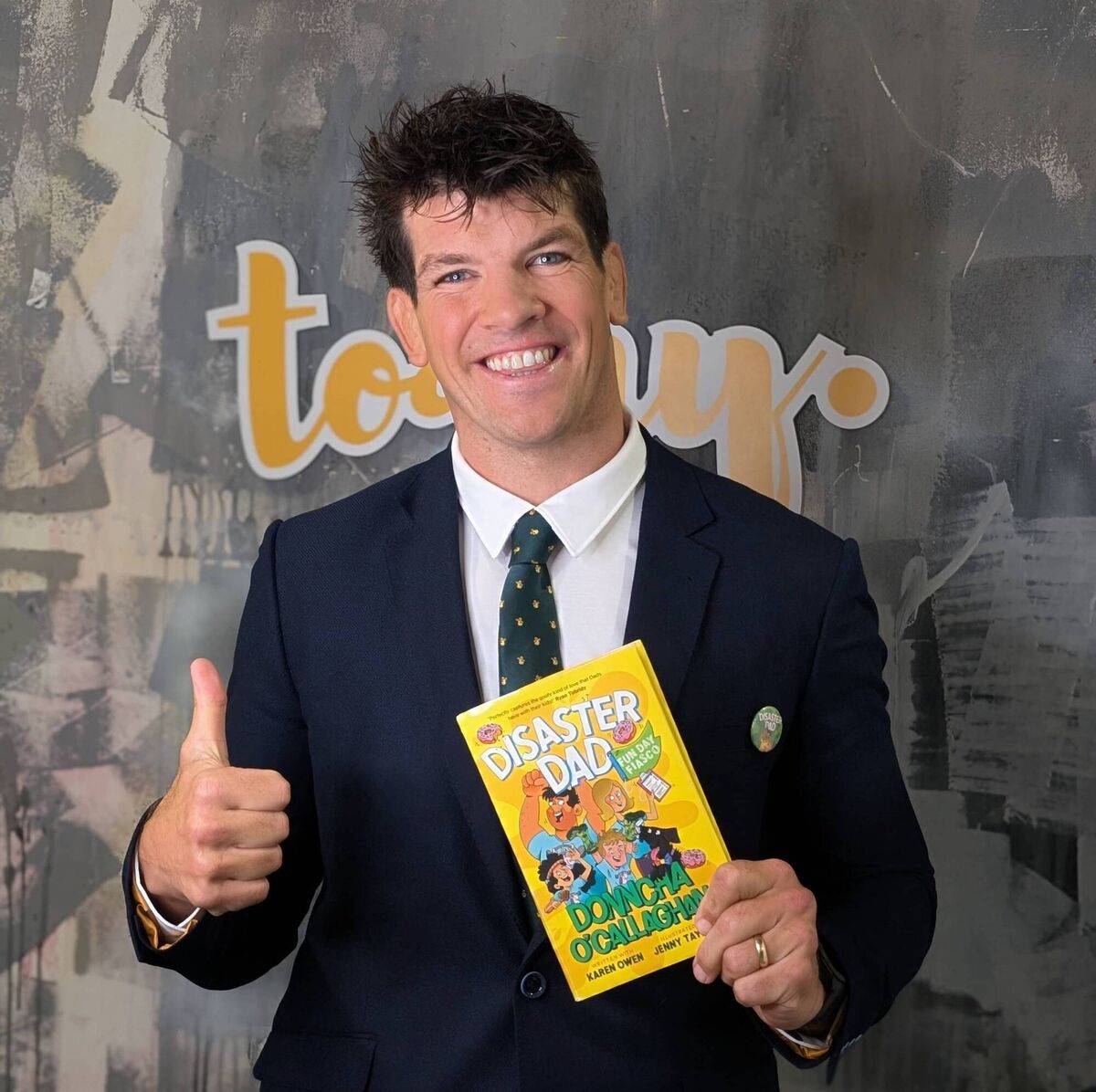 Donncha O'Callahan with his Disaster Dad, Fun Day Fiasco book. Donncha O'Callahan with his Disaster Dad, Fun Day Fiasco book.