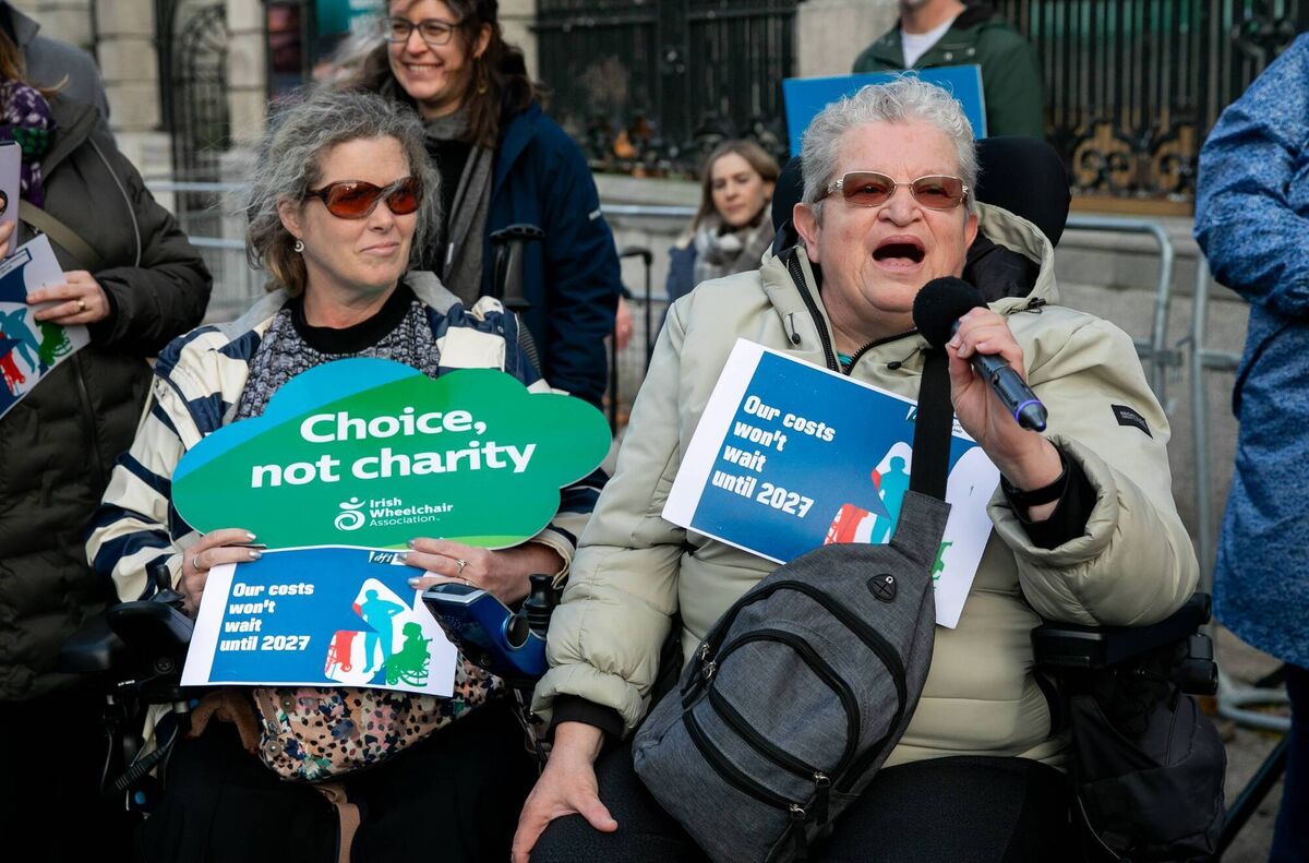 (Left to right) Edel Carey from Tipperary and Carolyn Akintola from Tallaght at the demonstration by the Disability Coalition. Ms Akintola said politicians during last year's election 'seemed to want to use the disability card as a way of getting elected'. Photo: Gareth Chaney (Left to right) Edel Carey from Tipperary and Carolyn Akintola from Tallaght at the demonstration by the Disability Coalition. Ms Akintola said politicians during last year's election 'seemed to want to use the disability card as a way of getting elected'. Photo: Gareth Chaney