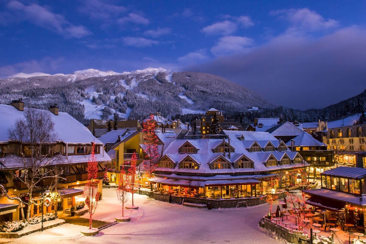 Scenic Whistler village with snowy Blackcomb mountain in background. Scenic Whistler village with snowy Blackcomb mountain in background.