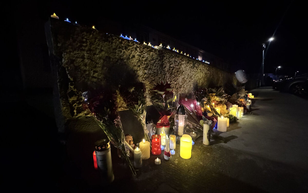 Candles and flowers left outside the house at Castleview Park where four-year-old Tadgh Farrell and his great aunt Mary Holt were killed in a suspected arson attack on Saturday in Edenderry. Photo: Bairbre Holmes/PA