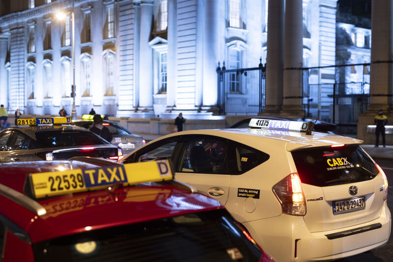  Dublin taxi drivers protesting against Uber outside Government Buildings in Dublin on December 3. There was also a protest attended by 200 drivers in Cork. See below. Picture: Sam Boal/Collins