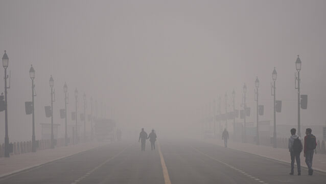 People walk in the smog in New Delhi (Piyush Nagpal/AP)