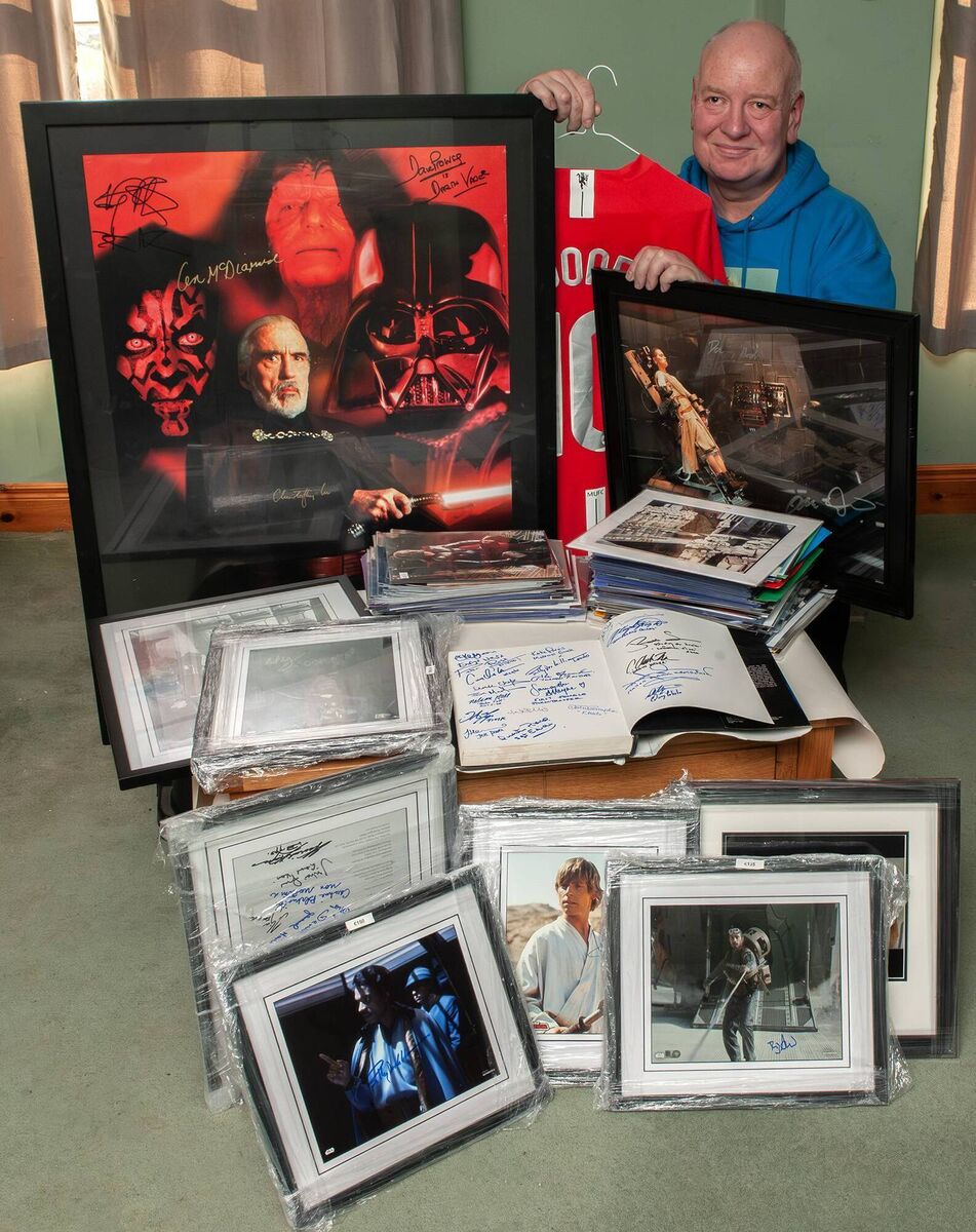 André Hendrick from Oulart, County Wexford, is pictured with a good selection of autographed, framed, and unframed photographs. Among his collection is a Manchester United jersey signed by Wayne Rooney. Picture: Jim Campbell