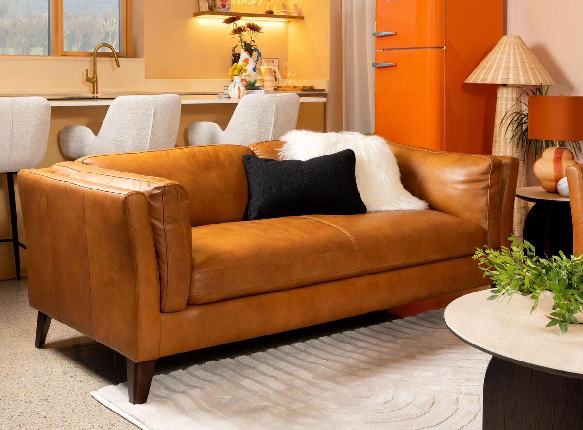  Splurge on a new sofa in the sales, like the Arc, and accessorise with a coffee table and rug. Picture: EZ Living Interiors