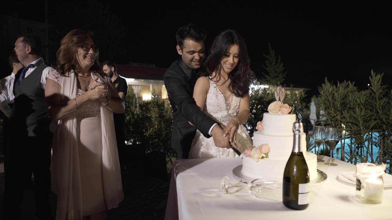 Lottie Ryan and her husband Fabio cut their cake.