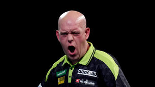 <p>Michael van Gerwen survived a scare against Mitsuhiko Tatsunami (John Walton/PA)</p>