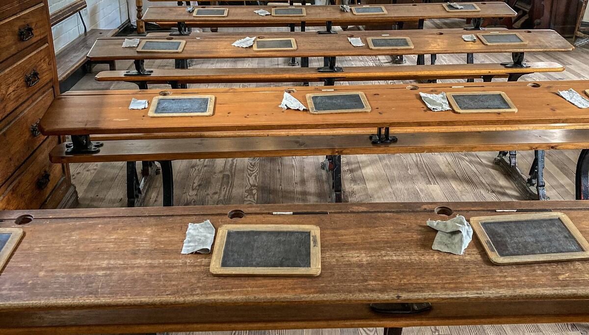 A Victorian school classroom - with bench seats and blackboards with chalk and clothes. Picture: iStock
