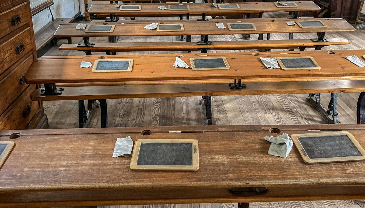 A Victorian school classroom - with bench seats and blackboards with chalk and clothes. Picture: iStock