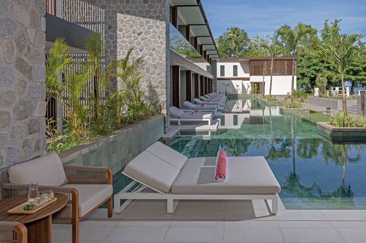 A lagoon-access room at Avani+ Barbarons Seychelles A lagoon-access room at Avani+ Barbarons Seychelles